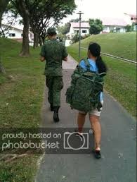 Image result for maid in singapore carrying soldier backpack gif