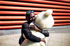 Happy Young Man Hugging Huge Teddy Bear High-Res Stock Photo - Getty Images