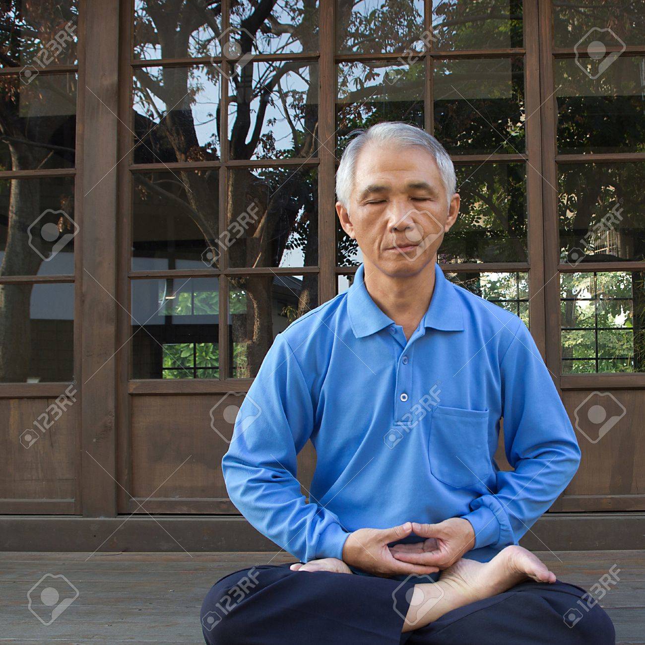 18911195-a-chinese-middle-aged-man-sit-quietly-for-practicing-zen-meditation.jpg