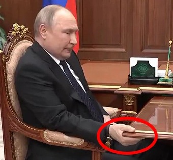 bloated-putin-seen-gripping-table-slouching-and-constantly-tapping-foot-fuelling-parkinsons-ru...jpg