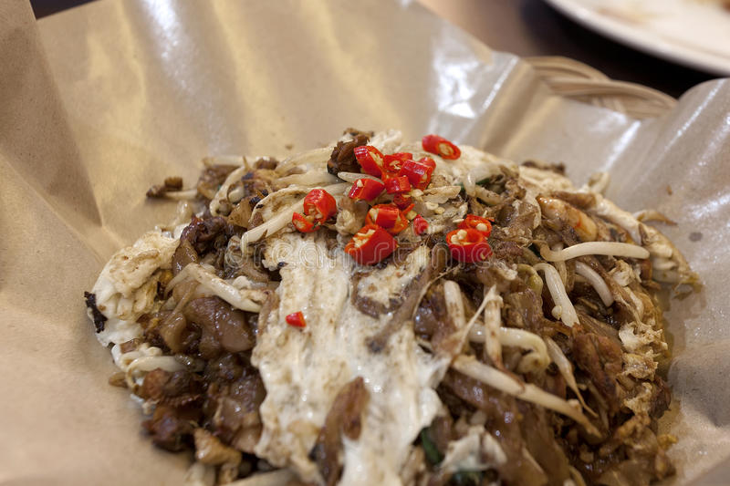 char-kway-teow-fried-noodles-closeup-stir-wide-rice-soy-sauce-eggs-bean-sprouts-prawns-red-chi...jpg