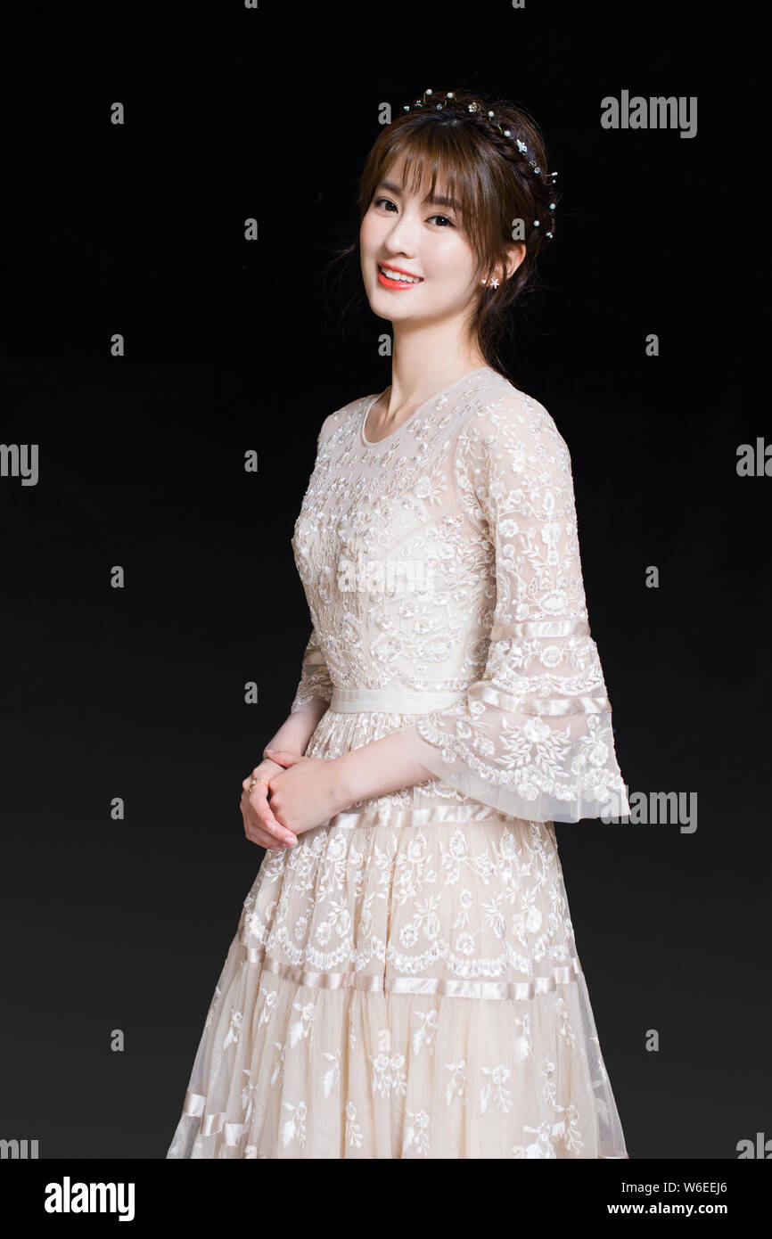 chinese-actress-qiao-xin-also-known-as-bridgette-qiao-poses-for-portrait-photos-during-an-excl...jpg