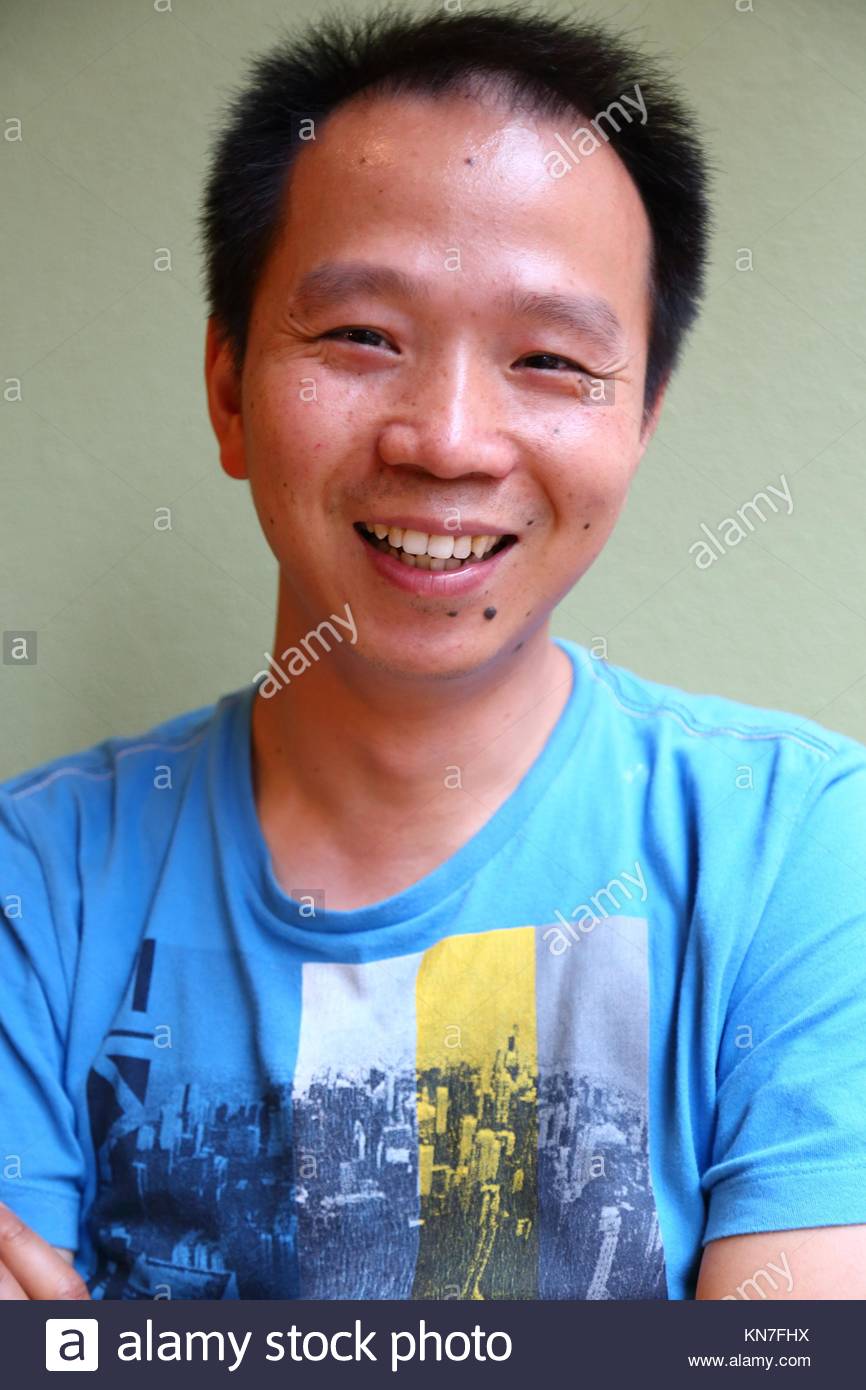 chinese-young-man-laughing-KN7FHX.jpg