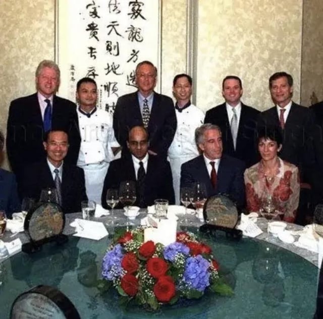 epstein-and-clinton-in-singapore-circa-2002-v0-2c6zb93ark7c1.jpeg