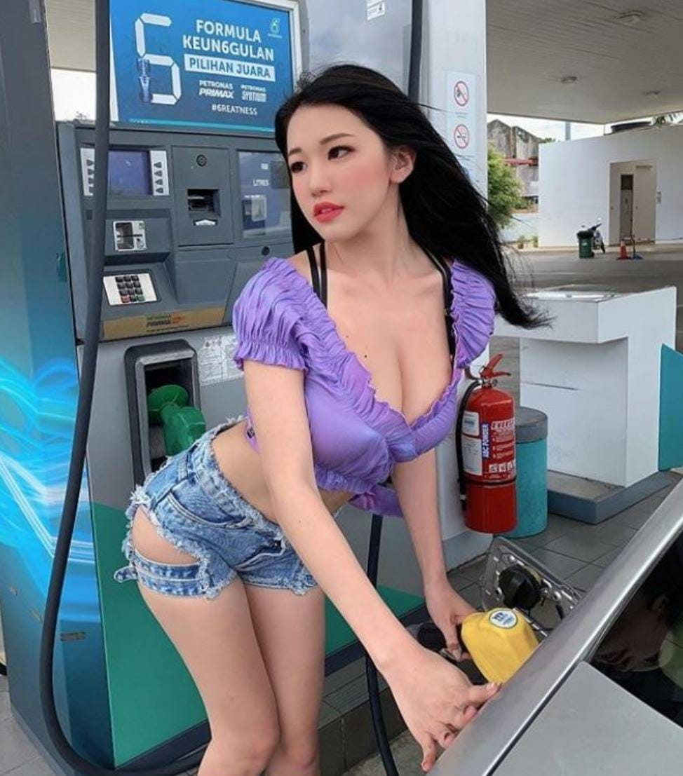 Girl at Petrol Station.png