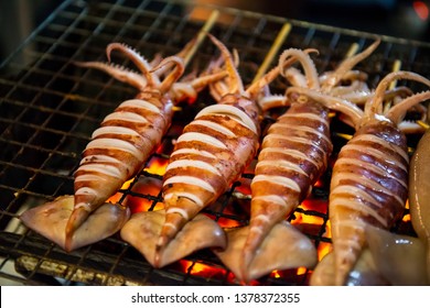 grilled-squid-on-charcoal-stove-260nw-1378372355.jpg