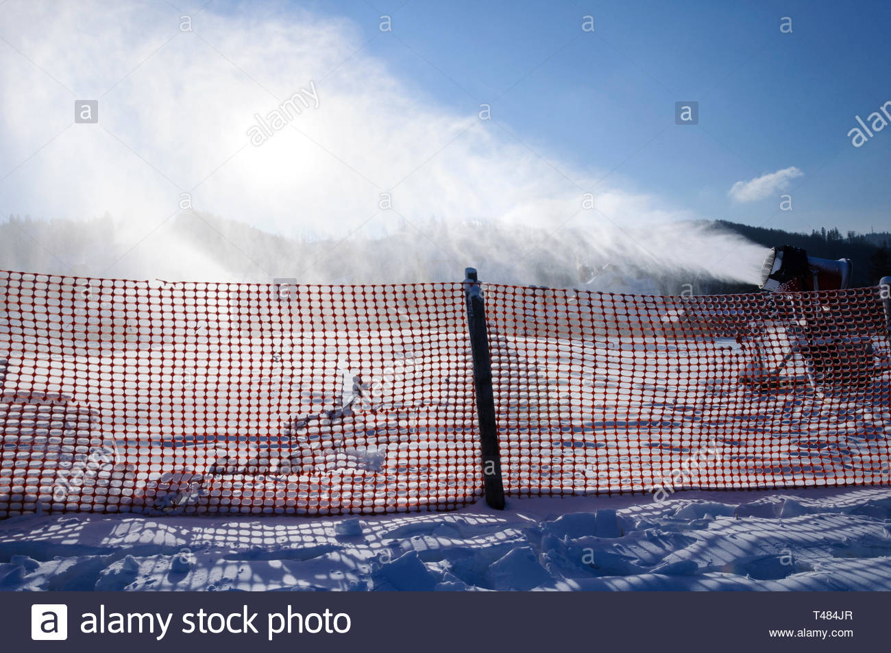 landscape-of-a-mountain-ski-resort-slopes-as-a-background-for-fence-and-snowmaking-machine-wit...jpg