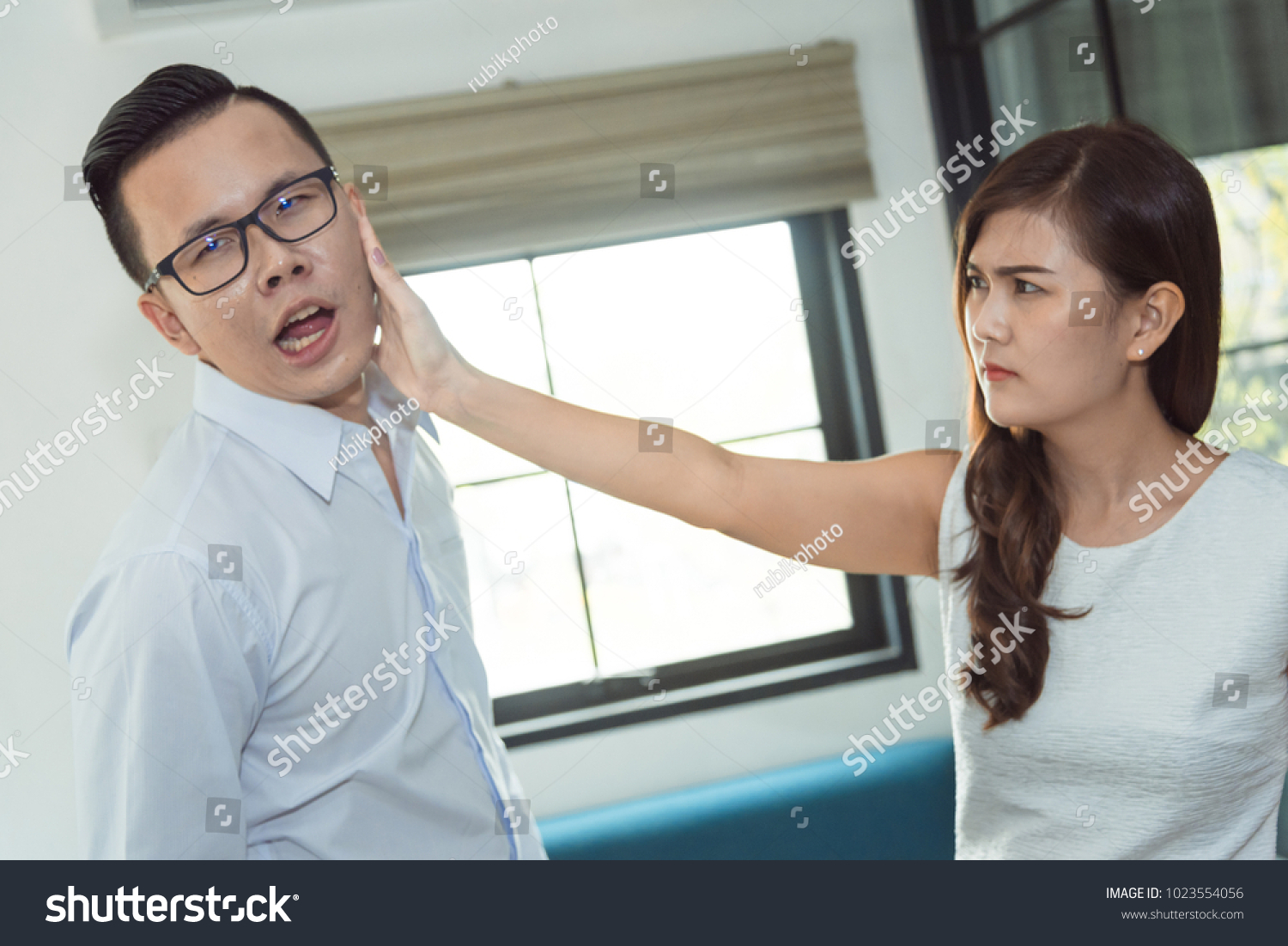 stock-photo-angry-beautiful-asian-woman-a-slap-in-the-face-with-her-husband-was-his-wife-becau...jpg