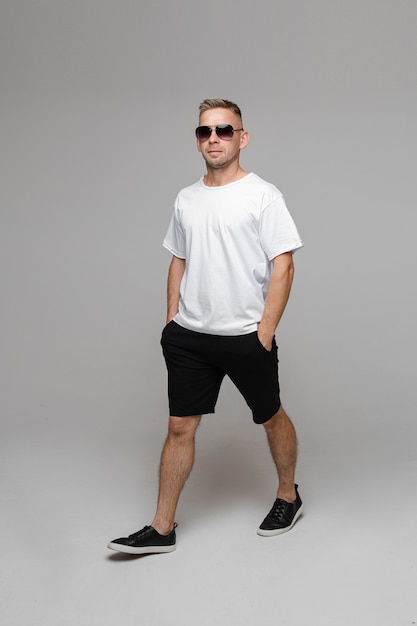 summer-outfit-men-one-walking-man-sunglasses-t-shirt-bermuda-shorts-walking-flat-shoes-with-ha...jpg