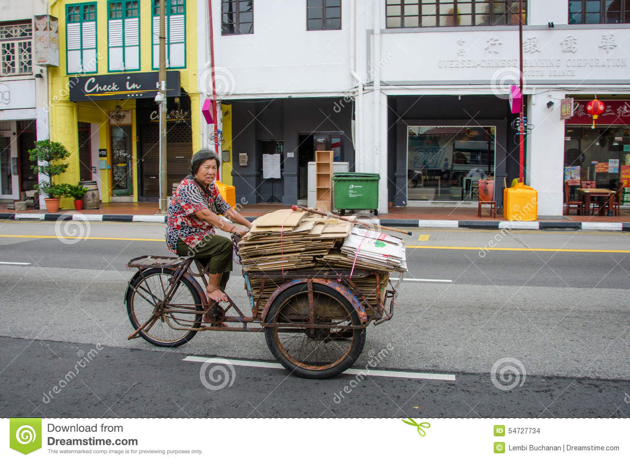 woman-bare-feet-transports-goods-old-rusted-tricycle-singapore-february-folded-used-cardboard-...jpg