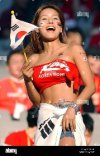 dpa-a-female-south-korean-soccer-fan-waves-a-flag-while-watching-her-D3A4PJ.jpg