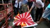 eGZyaDM0MTI=_o_taiwan-protesters-burn-japanese-flag.jpg