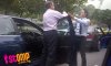 drivers_fight_in_the_middle_of_the_road_at_a_red_light-thumbnail.jpg